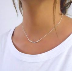 "Dainty silver necklace with beautiful disco beads Perfect to wear on its own or to layer with more necklaces of your collection. ⊹ D e t a i l s All components are 925 sterling silver ⊹ L e n g t h 15\" + 2\" extender chain  ⊹ Read about my shop Processing and Delivery times, Payment options, Packaging and Care instructions here: https://www.etsy.com/il-en/shop/annikabella#more-section" Minimalist Necklace Silver, Delicate Silver Necklace, Bead Bar Necklace, Prom Necklaces, Silver Beaded Necklace, Evil Eye Necklace Gold, Layered Necklaces Silver, Beaded Necklace Diy, Silver Bead Necklace