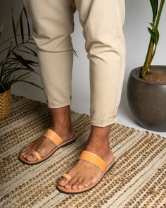 Men's handmade leather sandals in natural color are a stylish and functional choice for any occasion. Made from high-quality leather, these sandals are durable and comfortable to wear. The intricate detailing and design work add a touch of elegance to the overall look of the sandals.  All of our products are handmade with the best and highest quality leather from our beloved island of ''Crete''.  The leather used for each item may be irregular in terms of colour and texture due to its natural ch Adjustable T-strap Sandals With Leather Footbed, Adjustable Leather T-strap Sandals With Leather Footbed, Brown Leather T-strap Sandals With Leather Footbed, Cheap Leather T-strap Sandals With Cushioned Footbed, Brown T-strap Sandals With Adjustable Leather Sole, Handmade Leather Sandals, Ring Leather, Genuine Leather Sandals, Mens Shoes Sandals