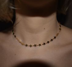 Simple & sweet star choker. One size fits all. About 12.5in-16in adjustable. If you are concerned with the size feel free to leave your measurements when you check out. Necklace is made of gold plated copper. Water, lotion, fragrances, sweat (any kind of moisture) can cause discoloration. Shipped with minimal packaging to avoid unnecessary waste. ♥️🌎 Check out our hanging stars choker here: https://etsy.me/2HiGzhi Check out our star gemstone here: https://etsy.me/31pUk68 Check out out our s Adjustable Dainty Star Jewelry, Trendy Star Charm Choker, Trendy Adjustable Star-shaped Necklace, Trendy Adjustable Star Necklaces, Star Print Jewelry As A Gift, Trendy Adjustable Jewelry With Star Charm, Trendy Star Charm Choker As Gift, Adjustable Star Choker, Trendy Choker With Star Charm For Gift