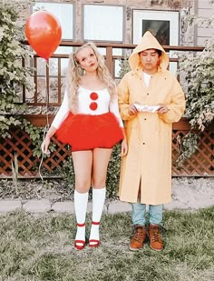 a man and woman dressed in costumes standing next to each other