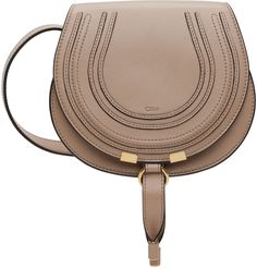 LWG-certified grained calfskin shoulder bag in beige. · Adjustable crossbody strap · Logo embossed at face · Concealed patch pocket at face · Tab-slot flap · Card slot at suede interior · Antiqued gold-tone hardware · H6.5 x W7.5 x D3.75 Supplier color: Deep beige Beige Saddle Bag With Detachable Strap, Beige Saddle Bag With Removable Pouch, Beige Saddle Bag With Gold-tone Hardware, Chloe Saddle Bag, Beige Leather Saddle Bag With Gold-tone Hardware, Brown Saddle Bag With Gold-tone Hardware, Chloe Marcie, Saddle Bag, Crossbody Strap