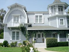 a large house with white trim and windows