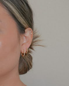 a woman with ear piercings on her ears