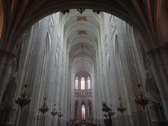 the interior of a large cathedral with high ceilings