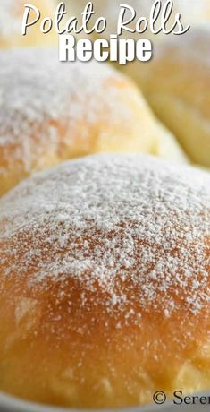 several rolls covered in powdered sugar sit on a plate with the words potato rolls recipe