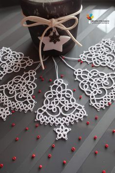 some white doily sitting on top of a table