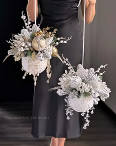 two bridesmaid bouquets are hanging from strings