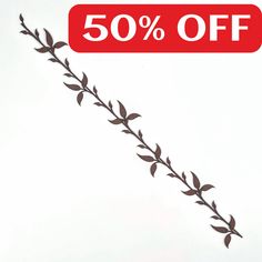 a red sign that says 50 % off on the side of a white background with leaves