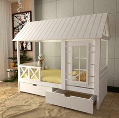 a white bunk bed with drawers underneath it and a dog on the floor next to it