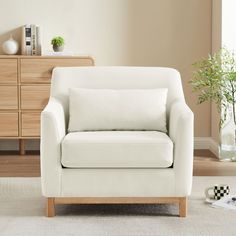 a white chair sitting on top of a carpeted floor