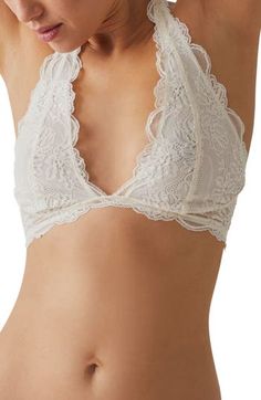 This sultry lace bra is designed in a halter silhouette with sweet scallop trim. Halter neck Partially lined 90% nylon, 10% spandex Hand wash, line dry Imported White Fitted Feminine Halter Top, Fitted Lace Bra With Lace Trim, Delicate Fitted Bra With Delicate Straps, Elegant White Triangle Top Bra, Sleeveless Lace Halter Top With Lace Trim, Elegant Triangle Top Bra With Delicate Lace, Fitted Lace Trim Halter Top, Fitted Lace With Built-in Bra, Feminine Stretch Lace Bra