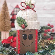 a cardboard christmas decoration with a smiling face on it