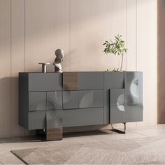 a modern sideboard with an unusual design in grey and brown tones, against a beige wall