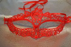 Red Lace Masquerade Mask Red Double 6mm Satin Ribbons each side (Approx 1m) to secure your Mask Comfortable and Soft to wear all Evening Complete with Silver Organza Carry Bag Measures: 22cm x 9cm Approx and will fit most Adults Beautiful Mask for any Occasion Masquerade Balls New Year's Eve Party Christmas Party Proms Weddings Halloween Party A Gift for your Wife or Girlfriend on Valentine's Day  Please Like and Share our Facebook Page https://www.facebook.com/SpecialEventDecorationsUK Red Eye Mask As Gift, Red Eye Mask For Gift, Red Eye Mask As A Gift, Red Party Masks For Mardi Gras, Red Eye Mask For Carnival, Red Eye Mask For Party, Red Eye Masks For Party, Red Masquerade Mask For Mardi Gras Gift, Red Eye Mask For Masquerade Costume