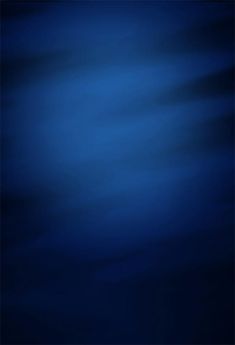 an abstract blue background with some light shining on the top and bottom part of it