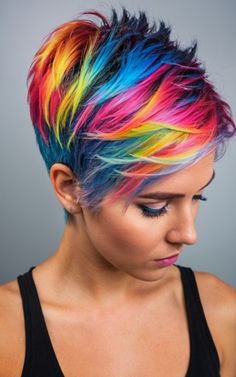 Unleash your inner rebel with these 16 edgy punk pixie haircuts. From choppy layers to vibrant colors, these cuts are designed to make you feel unstoppable. Rainbow Pixie Hair, Multi Color Hair Ideas, Rainbow Short Hair, Punk Pixie Haircut, Vivid Hair Color Ideas, Punk Pixie Cut, Unique Hair Cuts, Fun Haircuts