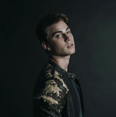 a young man is posing for a portrait