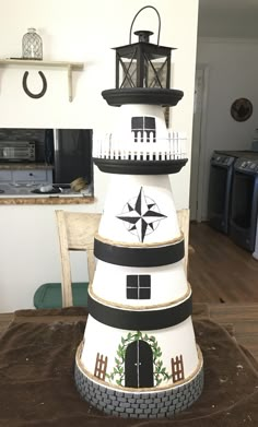 a tall white tower sitting on top of a wooden table