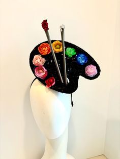 Painters pallette- Artist Headband- unique Fascinator -Rainbow Flowers headband - Hello, This Flower fascinator is made of a black sequins paint palette they has flowers as the colors. It's 9" wide. 2  paint brushes have Crystal on me and to signify paint for a little extra bling.   Its on a 1/2inch wrapped black headband. The headband can fit any head size and is adjustable to fit any size head. Even a big head like my own  I've been making hair pieces over 20 years. I love what I do and I hope you do too!  ----------------------------------------------- I ship US Postal Service.        USA DOMESTIC CHOICES (From mailed date in business days) First Class:  Arrives 3-5 days. Priority:        Arrives 1-3 days.                     Express:       Arrives 1-2 days. INTERNATIONAL CHOICES  (From Whimsical Handmade Headpieces For Costume Party, Whimsical Headband Fascinator For Costume Party, Whimsical Handmade Hat Fascinator, Crazy Hat Day Ideas For Adults, Crazy Hat Day Ideas, Art Headpiece, Carnival Headpiece, Surrealist Headpiece, Unique Fascinators