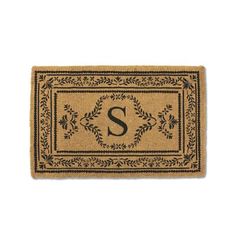 a door mat with the letter s on it and an ornate border around it,