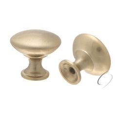 an antique brass cabinet door knob