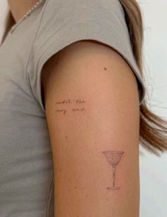 a woman with a small tattoo on her arm