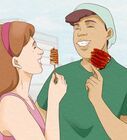 a man and woman brushing their teeth together