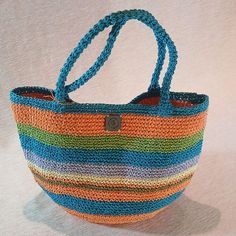 The Perfect Companion for Sunny Days ☀️️ Elevate your style with our handmade crochet tote bag made from natural paper yarn!  Perfect for the beach, picnics, or everyday use, this stylish bag is both lightweight and durable. Its spacious interior allows you to carry your personal belongings and small snacks with ease. A wonderful gift option to make your loved ones happy on special occasions!  Whether it's Mother's Day or Valentine's Day, show your love with this meaningful present. ❤️ Features: Bohemian Fair Trade Bucket Bag For Daily Use, Bohemian Jute Bucket Bag For Travel, Bohemian Bucket Bag For Beach, Bohemian Travel Jute Bucket Bag, Bohemian Handwoven Shoulder Bucket Bag, Bohemian Woven Bucket Bag For Everyday Use, Multicolor Hobo Bag With Adjustable Strap For Beach, Bohemian Bucket Hobo Bag For Beach, Bohemian Natural Bucket Bag For Daily Use