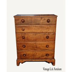 an old wooden dresser is shown against a white background with the words vintage la furniture on it