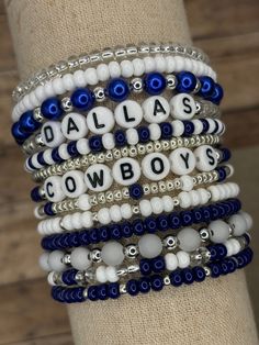 The ultimate bracelet listing for any Dallas Cowboys Football fan! Go Cowboys! These bracelets are SOLD INDIVIDUALLY unless purchased as a STACK! If wanting multiple bracelets, please add each one individually to your cart! Bracelets with letter beads can be personalized to exchange for a different word/name or player number. Please use the personalization box if wanting this; otherwise, your bracelet will come as pictured! PERSONALIZATION *ONLY* APPLIES TO BRACELETS THAT ARE PICTURED WITH LETTE Dallas Cowboy Bracelet, Perfect Bracelet Stack, Go Cowboys, Football Jewelry, Football Bracelet, Multiple Bracelets, Dallas Cowboys Football, Cowboys Football, Spring Hill