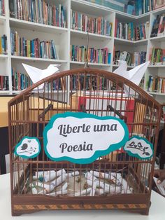 there is a birdcage with some books in it