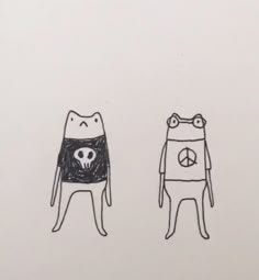 two drawings of cats wearing sweaters with peace signs on them