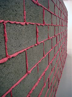 a brick wall with red lines on it