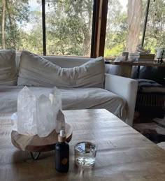 a living room filled with furniture and a table covered in white frosted rock formations