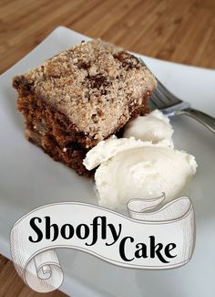 a piece of cake and ice cream on a plate with the words shooffy cake