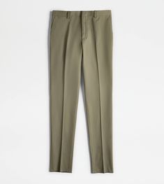 Pants in gabardine with ironed crease, fastened with zip, hook and counter-button. Featuring slanted front pockets, coin pocket and welt back pockets with button, they come with the leather tag on the back with stamped Tod's logo. Green Trousers, Leather Tag, Trucker Jacket, Pocket Pants, Trainers Women, Jogger Pants, Summer Collection, Down Jacket, Online Boutique