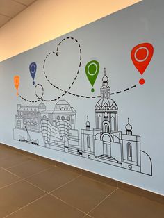 a wall painted with an image of a city and location markers on it's side