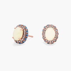 Show off a classic style with these opal gemstone earrings, framed in 14k rose gold and finished off with and elegant blue topaz and white sapphire halo. Precious Gemstones Jewelry, Opal Earrings, White Sapphire, Opal Gemstone, Semi Precious Gemstones, Gemstone Earrings, Blue Topaz, Gemstone Jewelry, Topaz