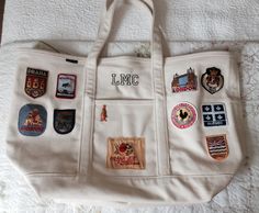 My collection of travel patches on a canvas bag. Perfect beach house luggage Canvas Bag With Patches, Travel Patches Display Ideas, Patch Bag, Ll Bean Backpack, Coach Travel Bag, Ll Bean Tote, Patches Display, Orange Backpacks, Bag Patches