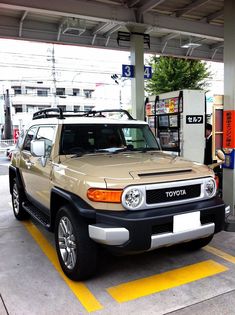 an suv is parked at a gas station