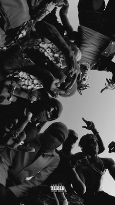 a group of people standing around each other