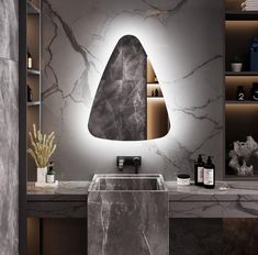 a modern bathroom with marble counter tops and walls, along with a large mirror on the wall