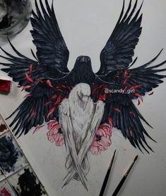 a drawing of a black bird with red flowers on it's wings, surrounded by paintbrushes