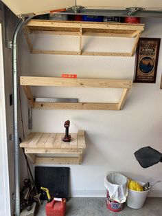 the shelves are made out of pallets and have tools on them, but no one is using them