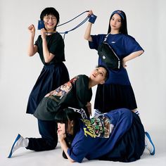 three young women are posing for a photo