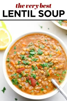 two bowls filled with lentula soup and garnished with parsley