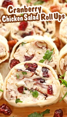 cranberry chicken salad roll ups on a cutting board with the words cranberry chicken salad rolls