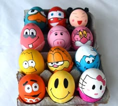 an egg carton filled with lots of different colored angry birds and other cartoon characters