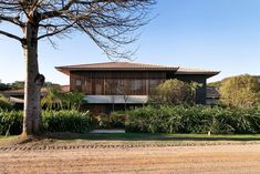 the house is surrounded by trees and bushes