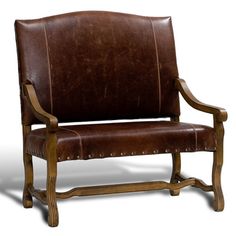 a brown leather chair sitting on top of a white floor next to a wooden frame